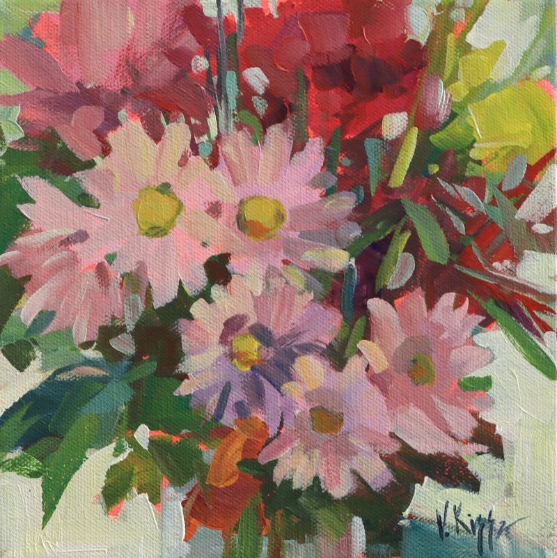 Colorful bouquet of flowers with pink daisies and other flowers on a white background